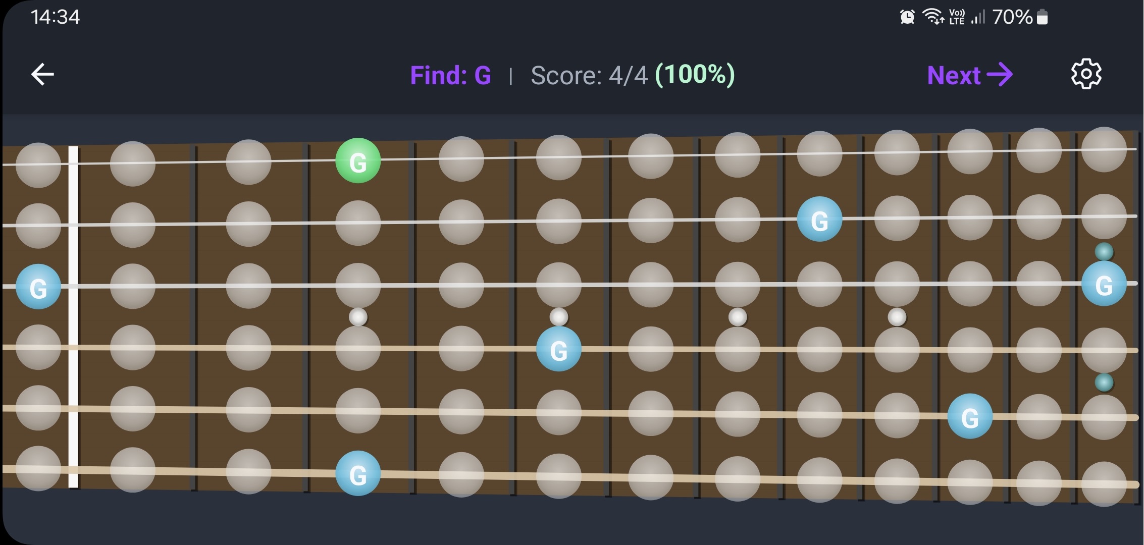 FretGenius Note Quiz feature shown on a smartphone screen held horizontally